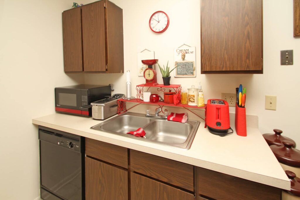 Modern kitchen with stainless steel appliances and wooden cabinets