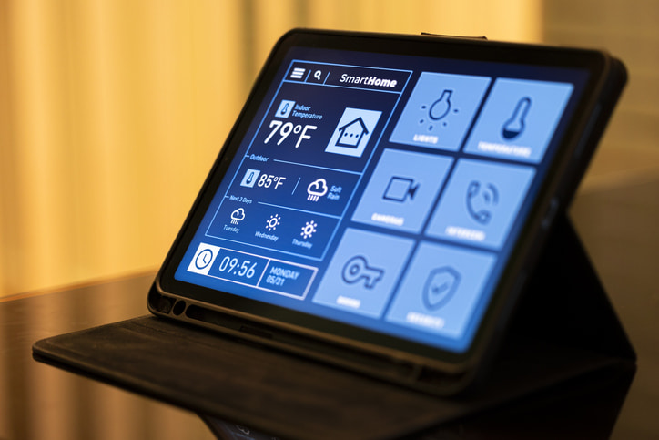 Renters in Lansing & Jackson, MI, using smart home gadgets with tablet control