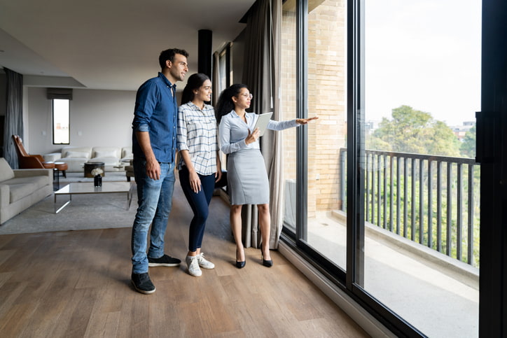 Prospective tenants reviewing an apartment before renting in Lansing & Jackson, MI